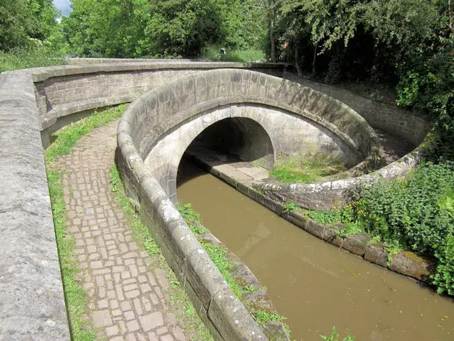 Stone-built Snake Bridge on the Macclesfield Canal, England