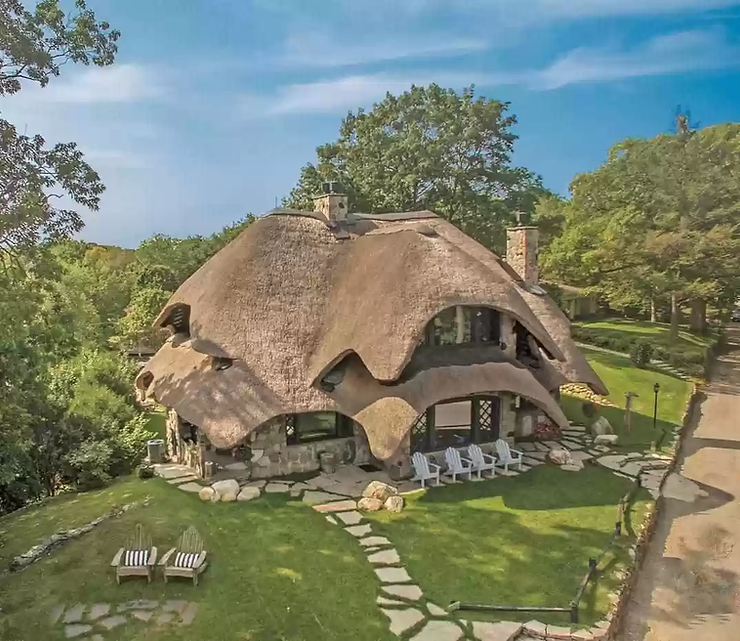 1918 Famous Charlevoix Mushroom House With 10 Bedrooms & European Roof For $4.5M!