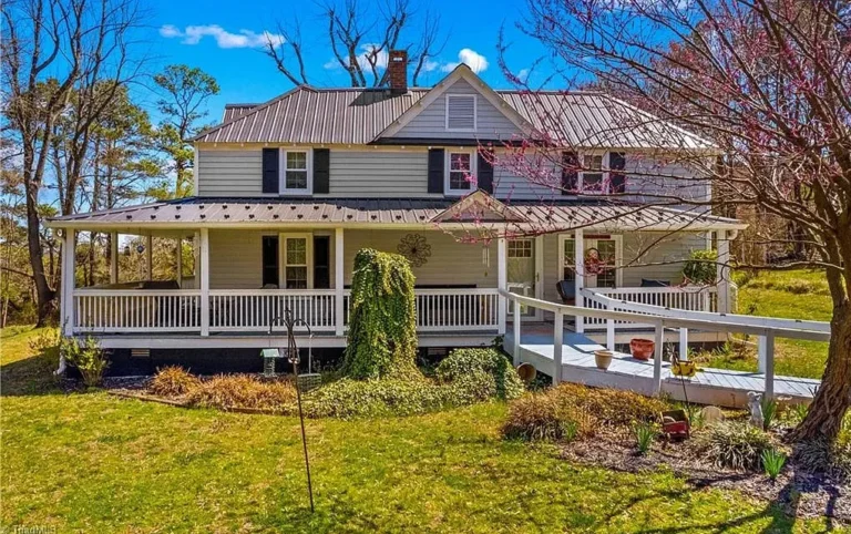 Beautiful setting with a long tree-lined driveway! Over three acres in NC. $249,900