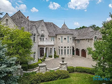 $2.8M Riverfront Dream! 6-Bed Luxury, Deep Water Access, 6-Car Garage & Elevator!