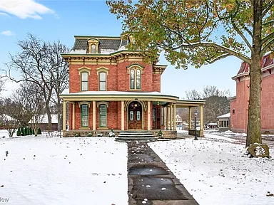 Stunning 1874 Brick Victorian with 4 Fireplaces, Wraparound Porch & 3-Car Garage!