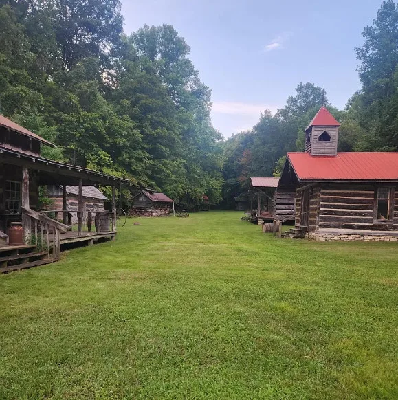 OMG! I want this village! That old chapel is so cool! Ten cabins on 22 acres in Kentucky. $350,000