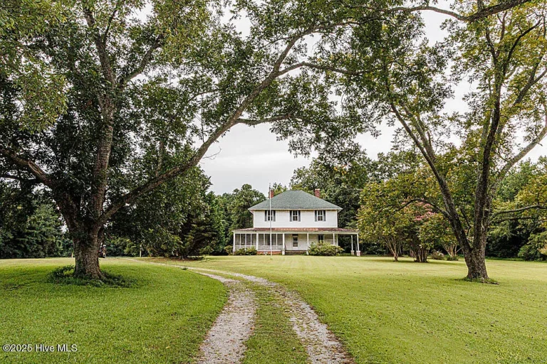Love the long driveway! C. 1911 in North Carolina. $129,900.