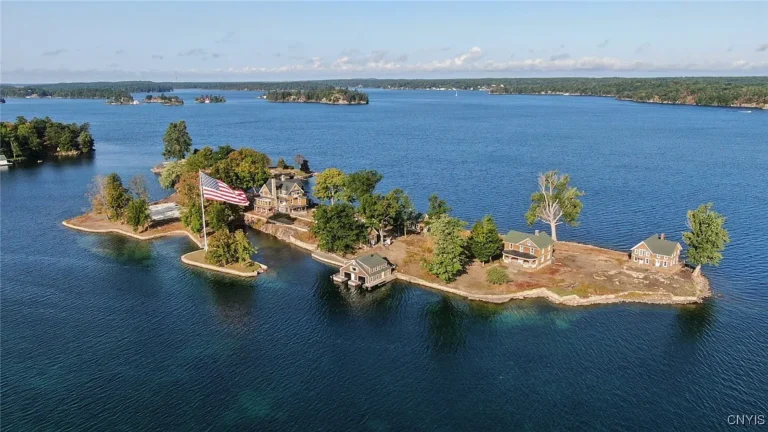 Check out that boathouse! Private island with three guest cottages in NY.