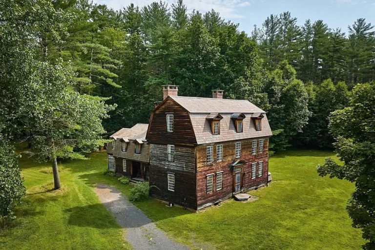 Ten fireplaces and a brick cottage! C. 1900 on 53 riverfront acres in Massachusetts.