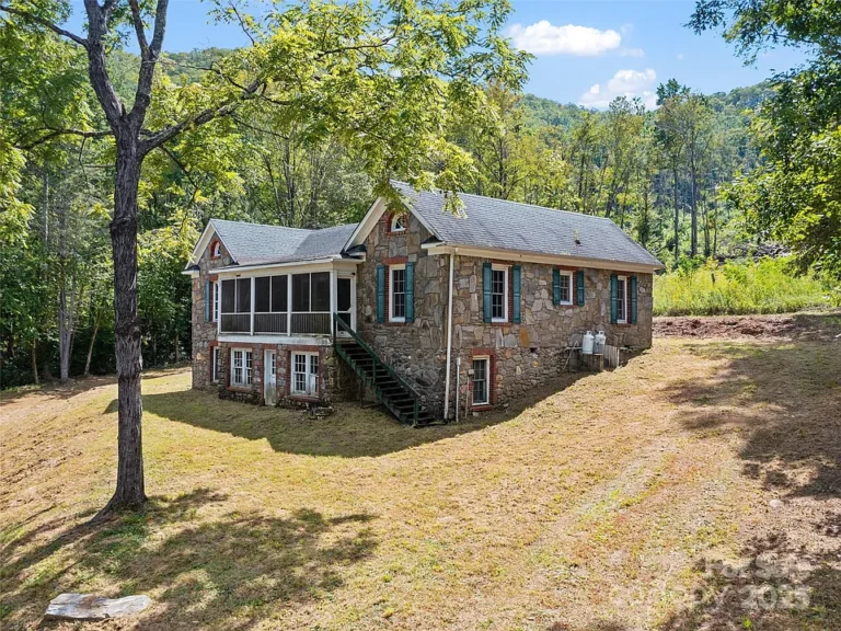 Check out that porch!! Private cottage on 40 acres in NC. $341,775.