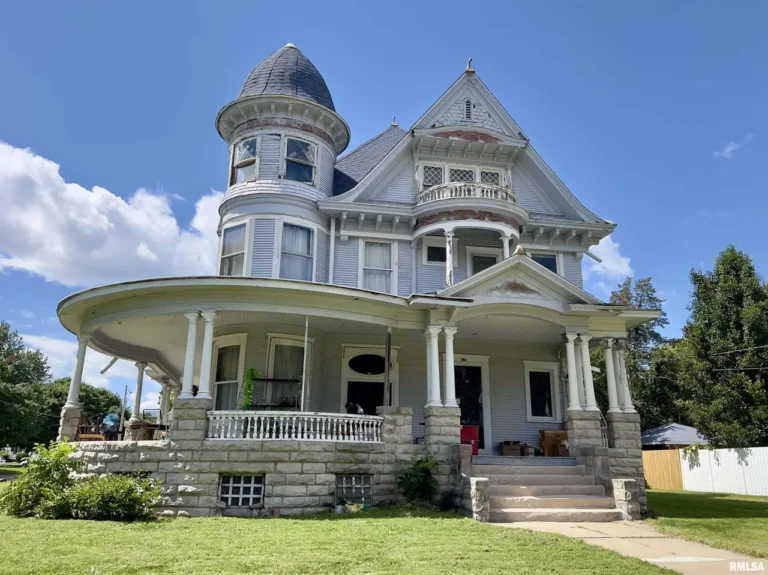 Beautiful woodwork! Huge wrap-around porch! C. 1903 in Illinois. $153,499.