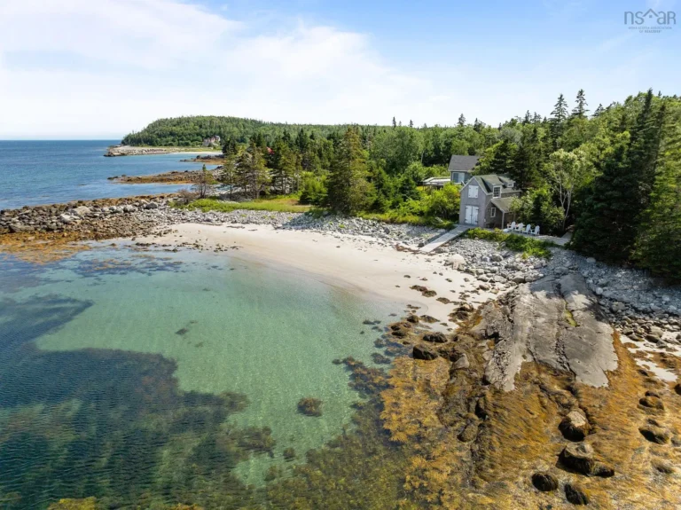 Check out the boathouse! C. 1900 on 25 acres with a private beach in Nova Scotia. $620,000