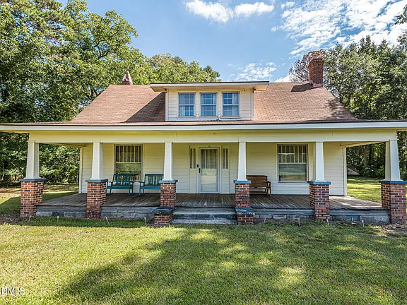Pretty porch and setting! Over two acres in NC. $230,000.