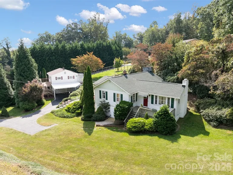 Two homes for the price of one! 0.7 acres in Candler. $389,000.