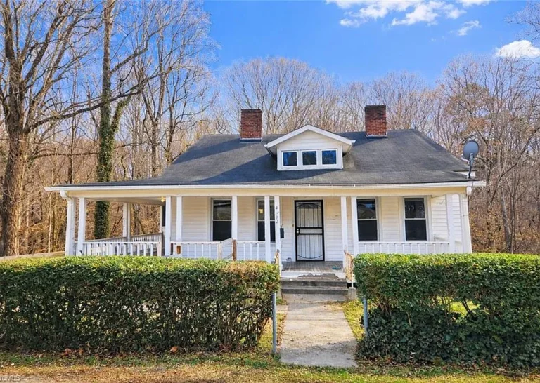 Pretty fireplace and setting! 1930s classic in Winston-Salem. $98,000.
