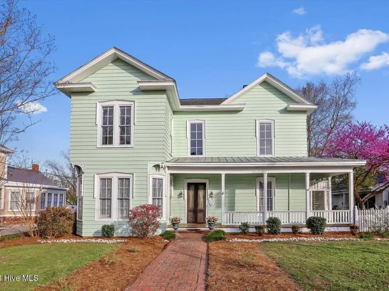 Pretty woodwork and pastel charm! C. 1900 in North Carolina. $285,000.