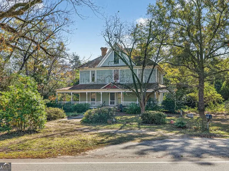 Check out the fireplaces!! Historic farmhouse on 15 private acres in GA. $299,999.