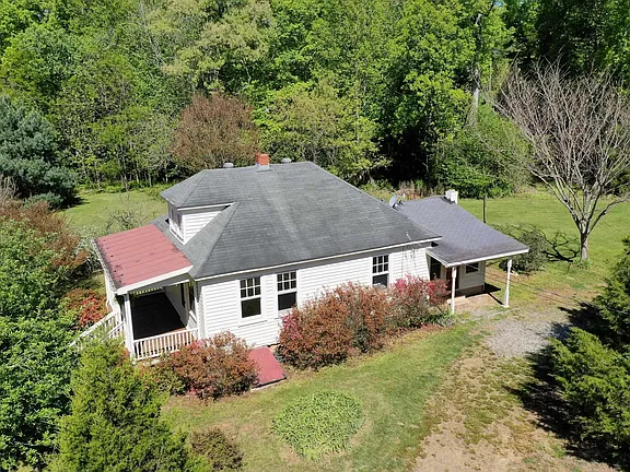 Check out the wood stove! Updated 1930s cottage on 4.25 acres in Virginia. $225,000.
