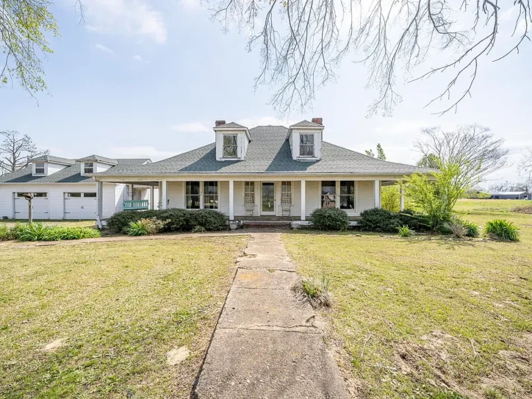 Huge wrap-around porch! C. 1918 farmhouse on 5 acres in Tennessee. $215,000.