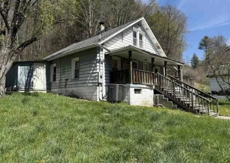 Fixer Upper Alert! Huge wrap-around porch! 13 acres in West Virginia for $84,000.