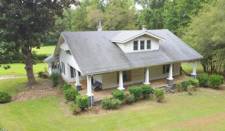 $195,000. Pretty setting! Love the porch! Almost two acres in North Carolina.